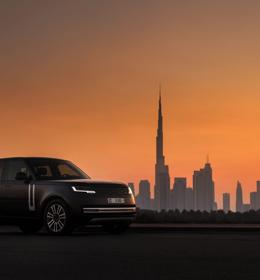 Range Rover tinted by Nanoz against the Dubai skyline at sunset