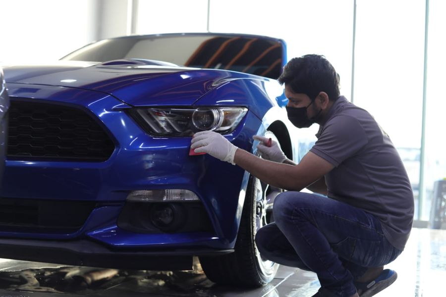 Paint protection film applied to a blue Ford Mustang
