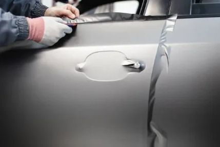 Vinyl car wrap being applied