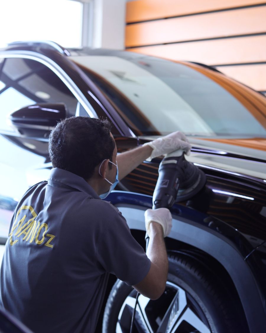 Nanoz installer finishing a nano-ceramic tint